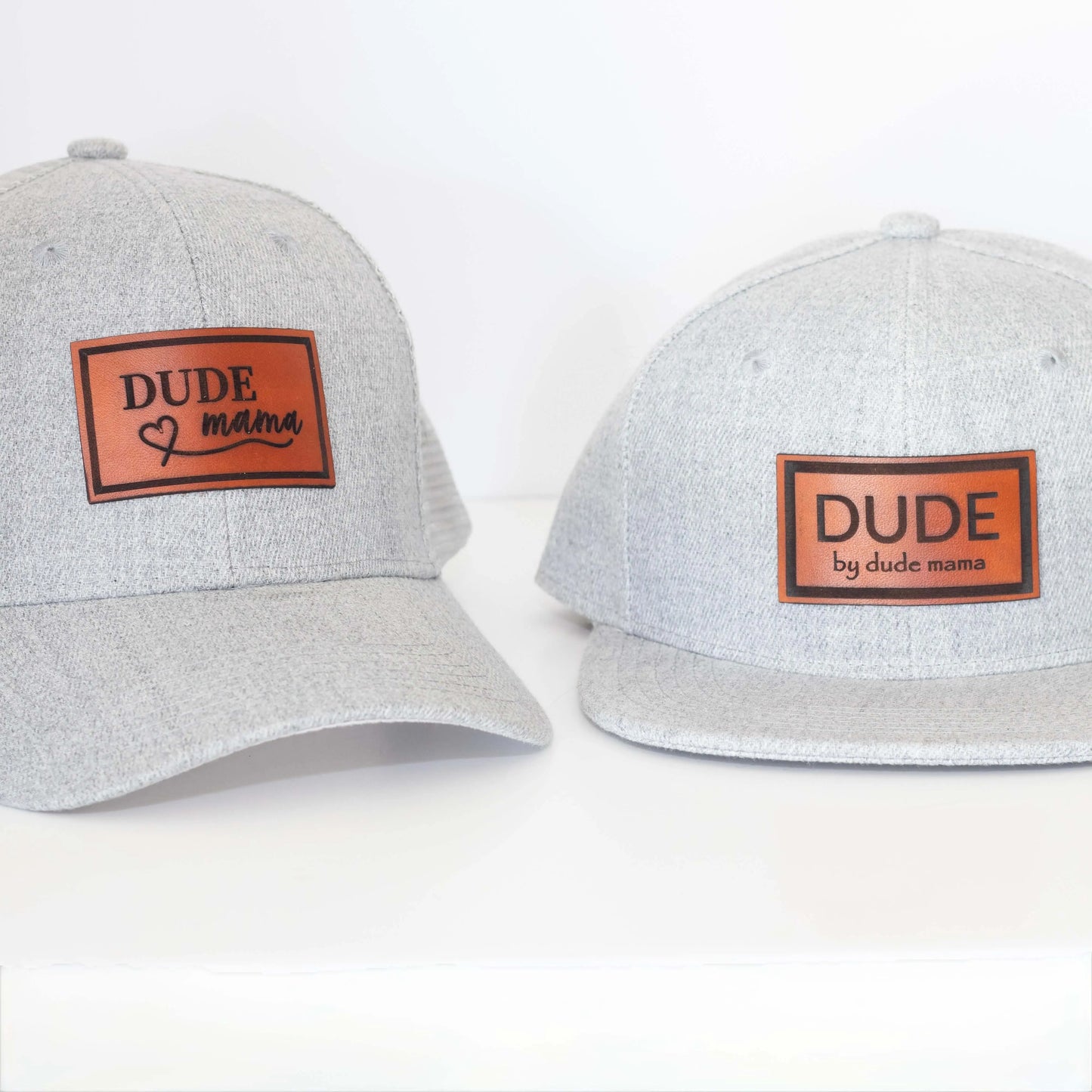 Light gray matching hats for Mama and Dude with engraved leather patches. Boy mom hat