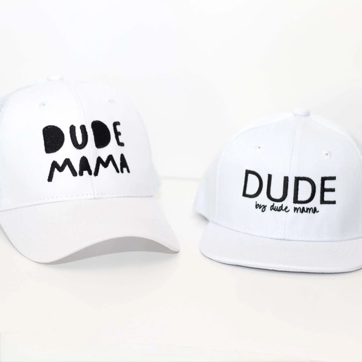White matching mom and son hats for Mama & Dude, featuring embroidered text, perfect for family photos and adventures.