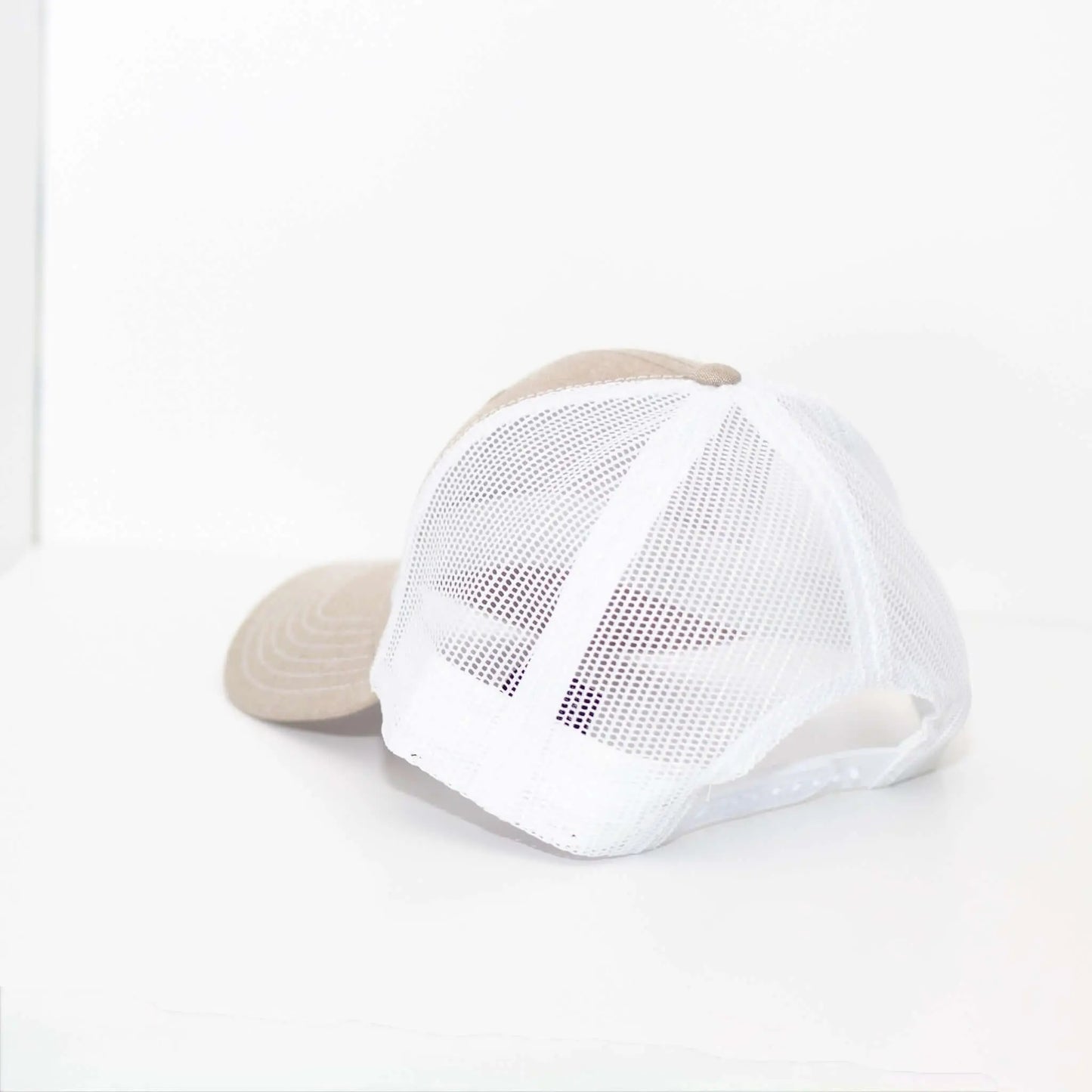 Cream and white boy mom hat featuring a cotton blend fabric and mesh back design for comfort and style.
