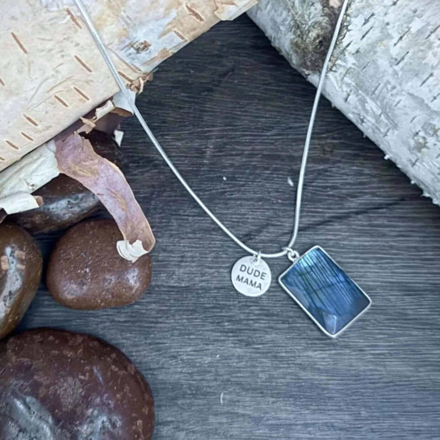 Engraved Dude Mama Labradorite Blue Fire Necklace - Rectangular Shape displayed on wood. A great baby shower gift.