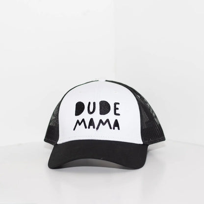 Black and white boy mom hat. The hat says 'Dude Mama' and is on a light gray background