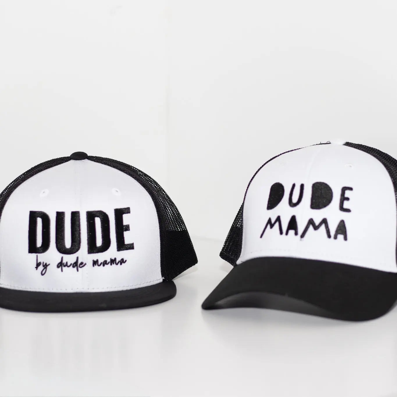 Black and white boy mom hat - the curved brim hat says 'Dude Mama'. There is a matching flat brim hat for son that says 'Dude'. It's a kids hat. This is a great mom and son matching outfit.