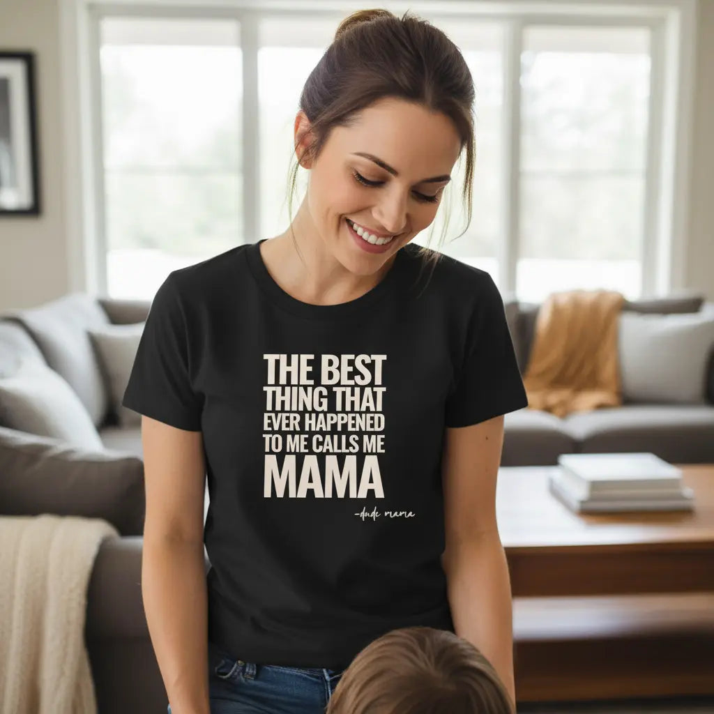 Mom smiling and wearing a boy mom shirt that says 'The Best Thing That Ever Happened To Me Calls Me Mama'.