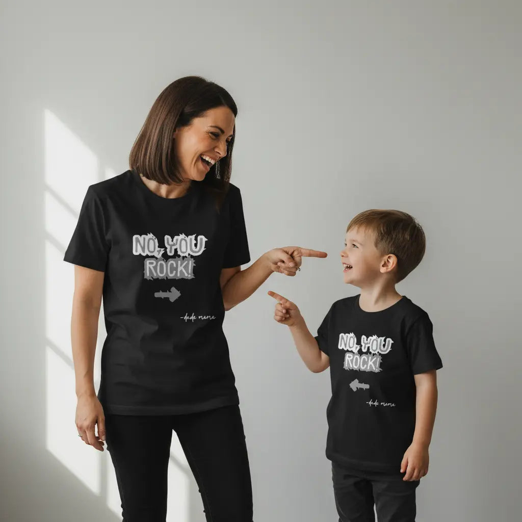 Mom and son wearing matching black shirts that say 'No, You Rock!' with an arrow pointing at the other person. They are having fun in this mom and son matching outfit.