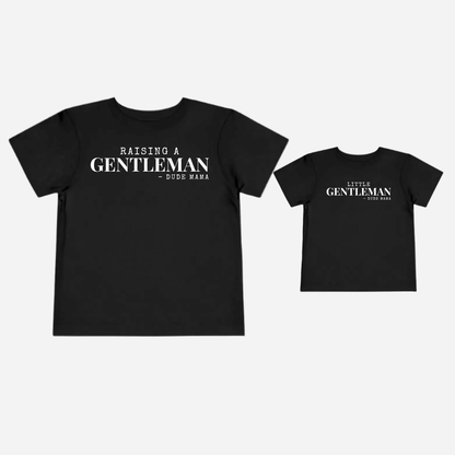 Raising Gentlemen Boy Mom Shirt showcasing a black t-shirt with lettering for moms raising kind boys.