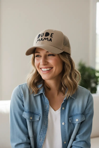 Mama wearing tan boy mom hat with black embroidery that says 'Dude Mama', perfect for boy moms.