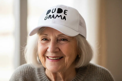 Grandma wearing a white hat that says 'Dude Grama'.