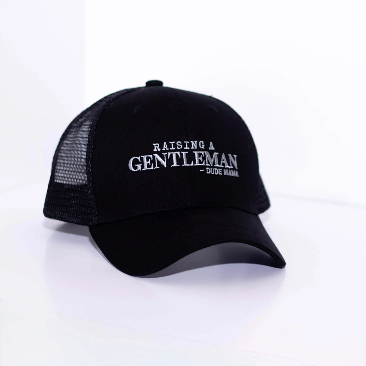 Raising a Gentleman - Boy Mom Hat in black with mesh back, perfect for moms raising boys.