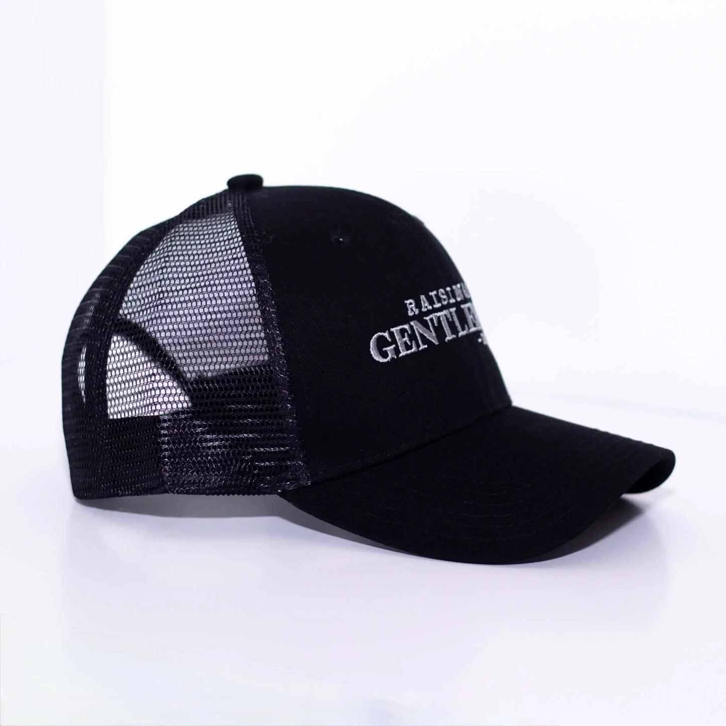 Raising a Gentleman - Boy Mom Hat in black with mesh back, perfect for moms raising boys. Side profile