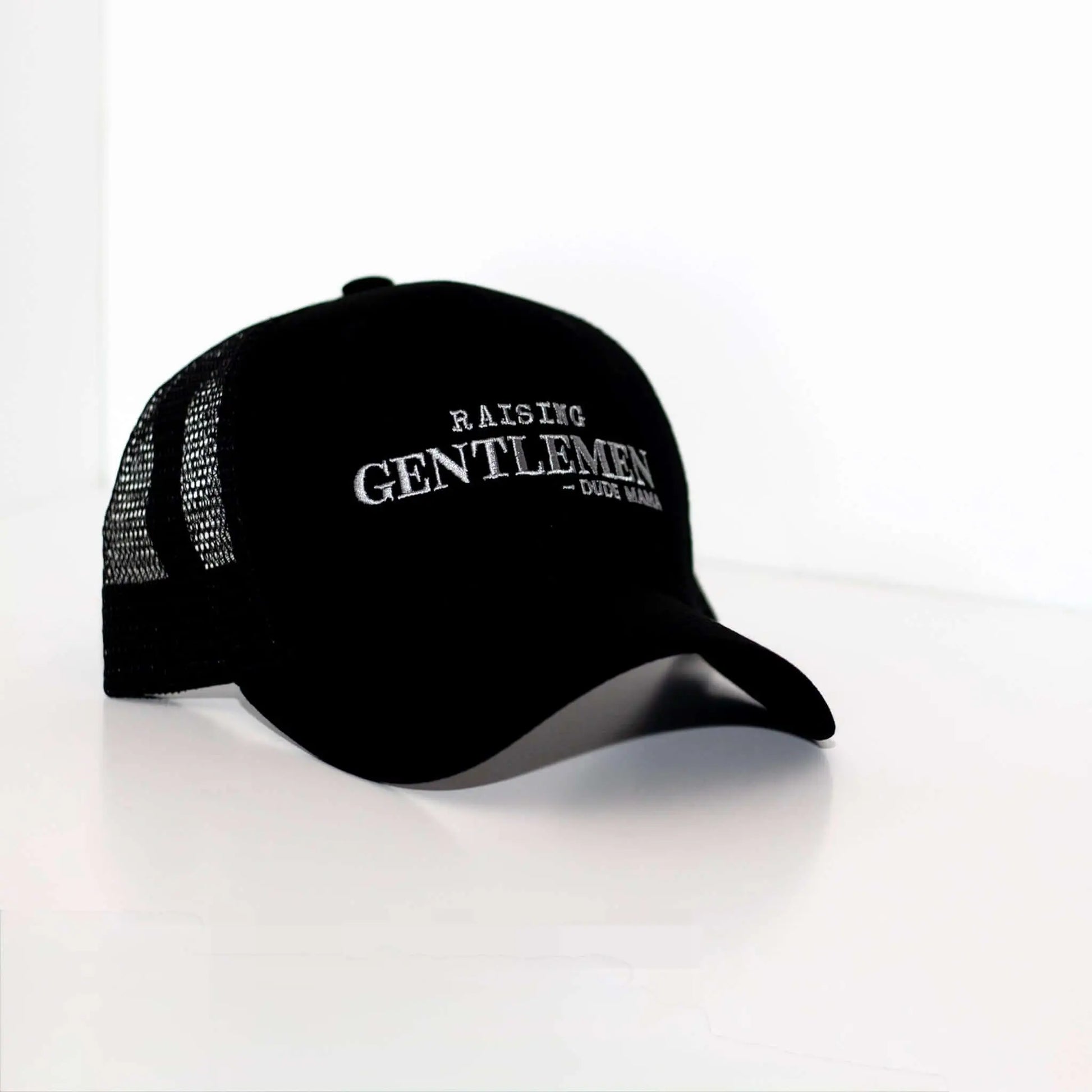 Boy Mom Hat | Raising Gentlemen Mama Hat. Hat is a little further back in picture.