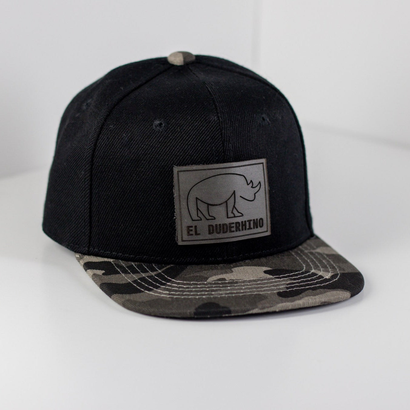 El Duderhino Black w/ Camo Brim Trucker Hat