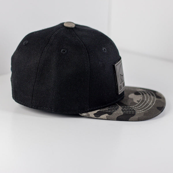 El Duderhino Black w/ Camo Brim Trucker Hat